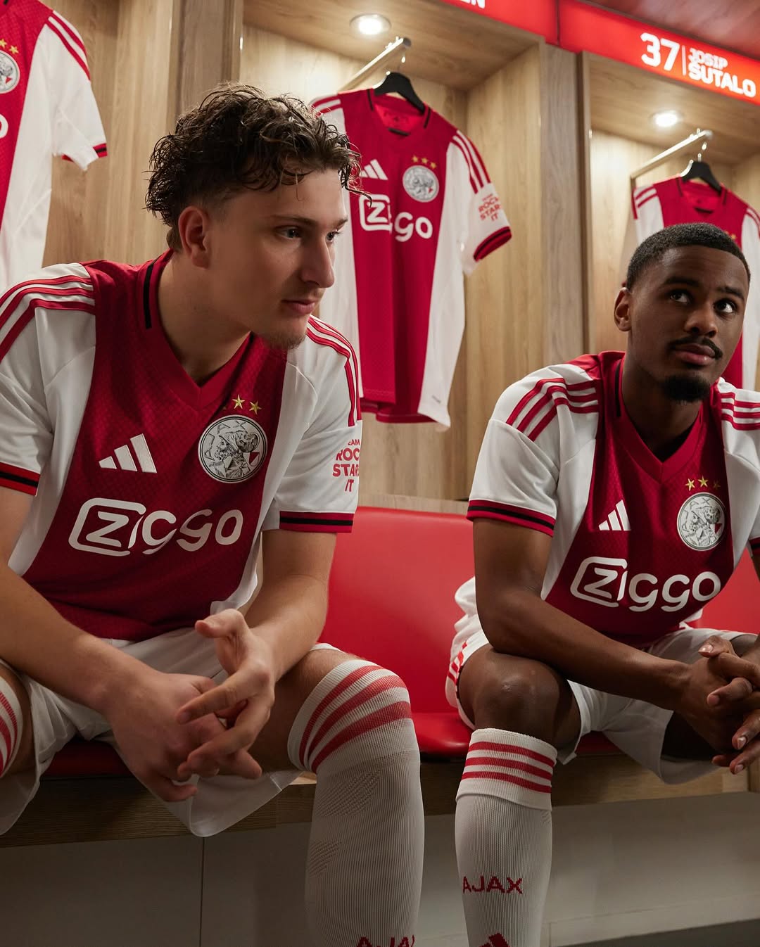 Ajax's players wearing Ajax 2025-2026 Home Kit