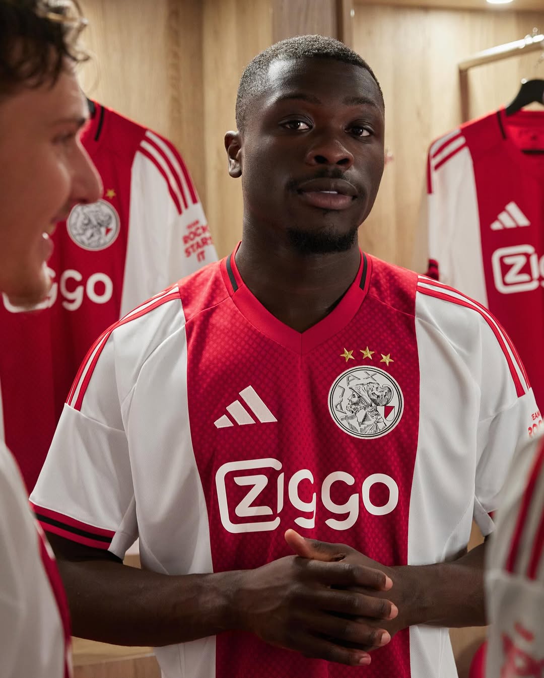 Brian Brobbey wearing Ajax 2025-2026 home kit
