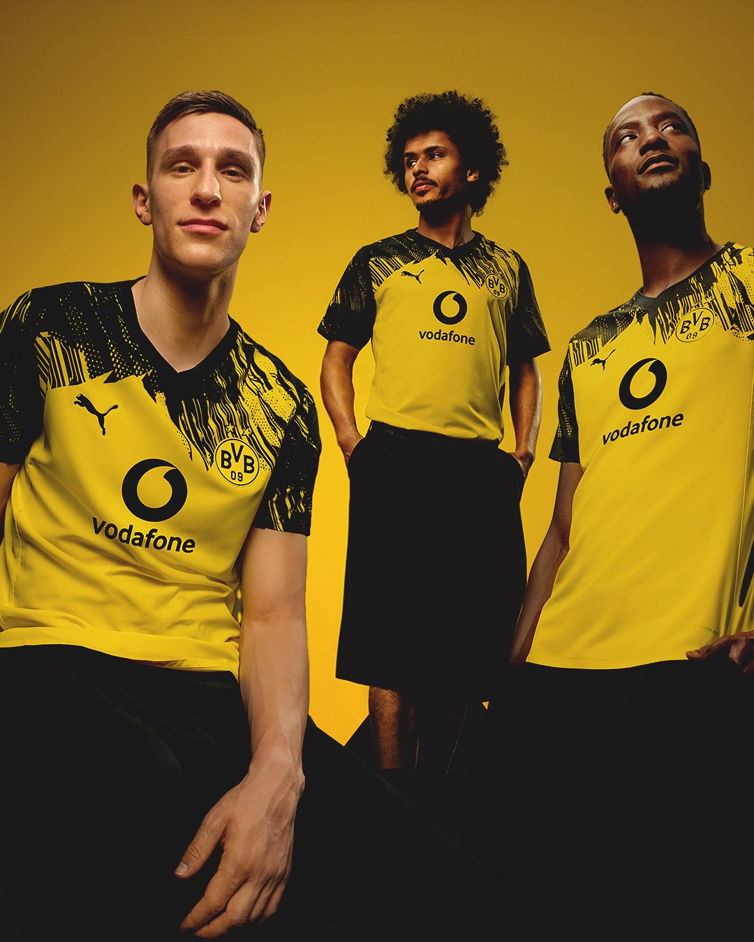 men players wearing Borussia Dortmund 2025-2026 Home Kit