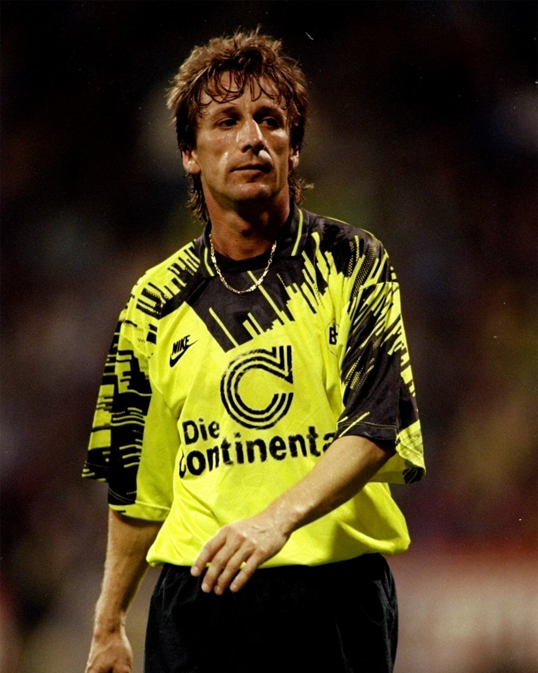 A former Borussia Dortmund player wearing the orussia Dortmund 1993-1994 home kit that inspired the 2025-2026 home kit