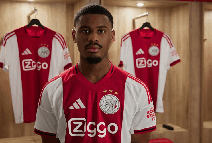 Ajax player wearing the Ajax 2025-2026 home kit