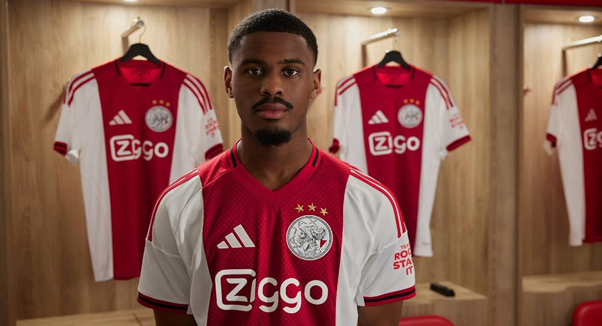 Ajax player wearing the Ajax 2025-2026 home kit