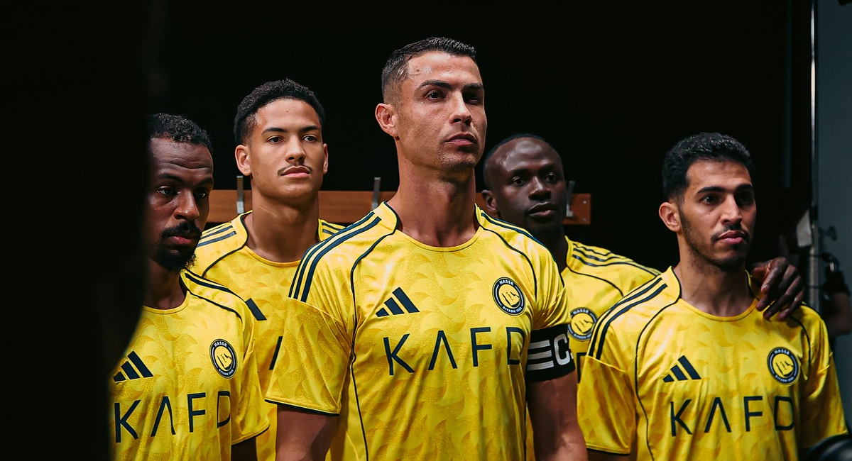 Cristiano Ronaldo and other Al Nassr players wearing Al Nassr home kit 2025-2026