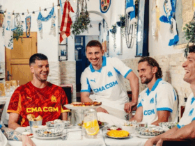 Olympique de Marseille players eating with the Olympique de Marseille 2025-2026 home kit