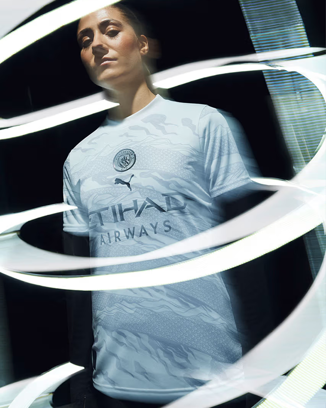 A woman Manchester City player wearing Manchester City 2024 Special Kit