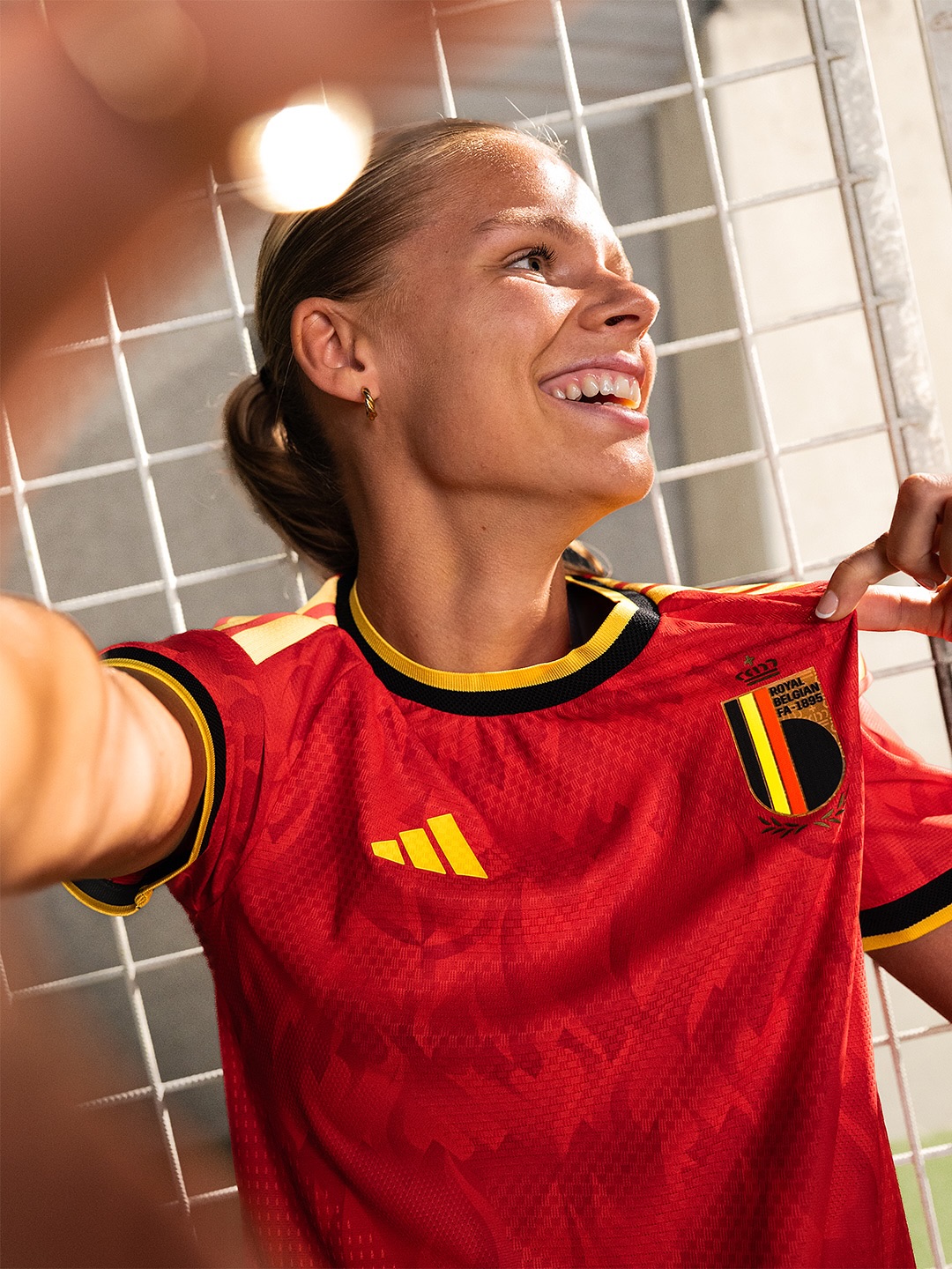 A woman wearing Belgium world cup home kit