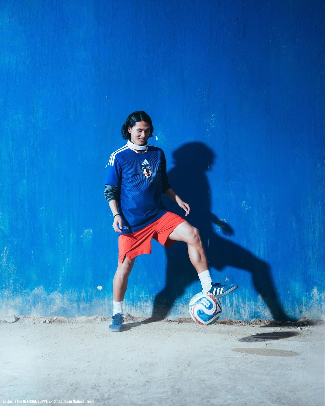 Takumi Minamino wearing Japan World Cup 2026 home kit
