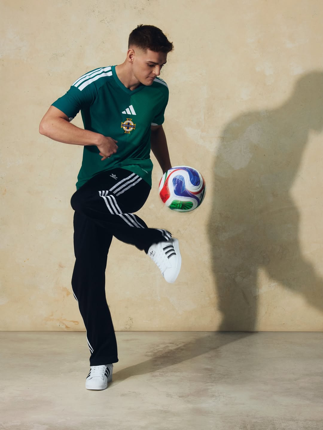 Justin Devenny wearing Northern Ireland 2026 World Cup home kit