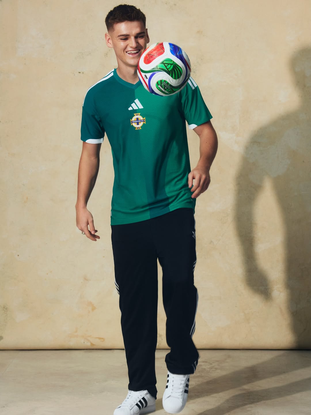 Justin Devenny wearing Northern Ireland 2026 World Cup home kit
